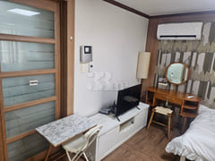 It is a studio apartment with a kitchen. 2th image