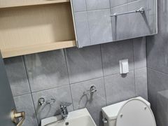 Clean white and gray studio apartment 5th image