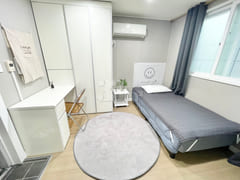 Newly remodeled white-toned room 6th image