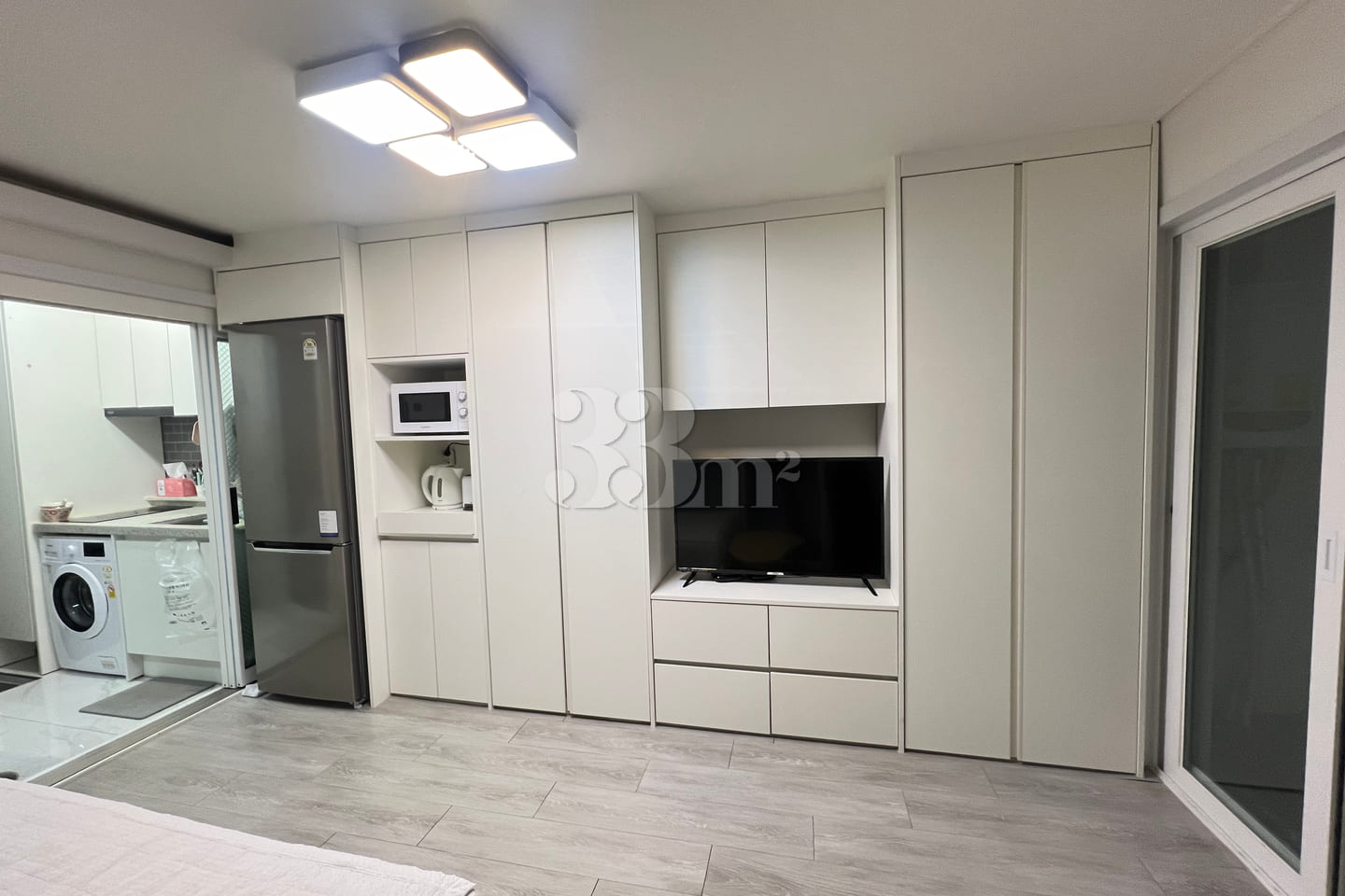 Fully furnished white-themed room in Junghwas 3th image