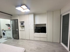 Fully furnished white-themed room in Junghwas 3th image