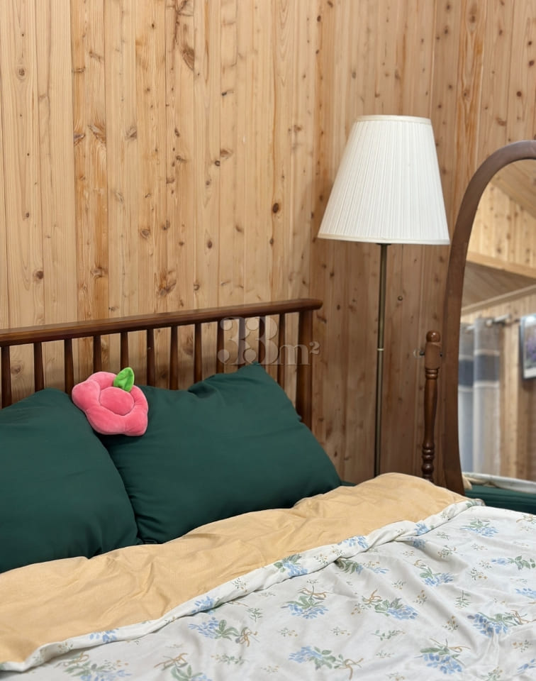 A room with a pretty garden in the forest. 5th image