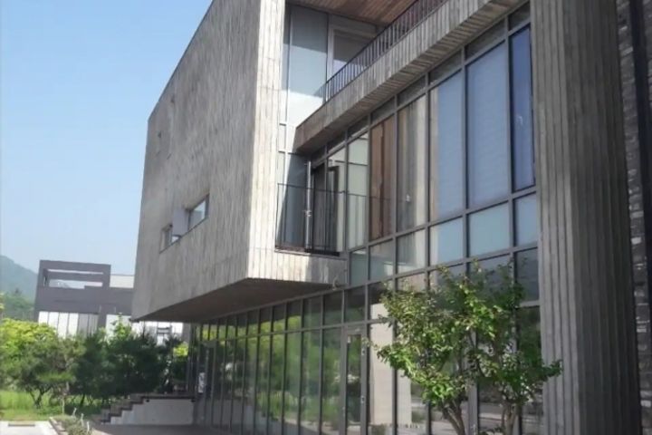A glass-walled room with a terrace 1th image