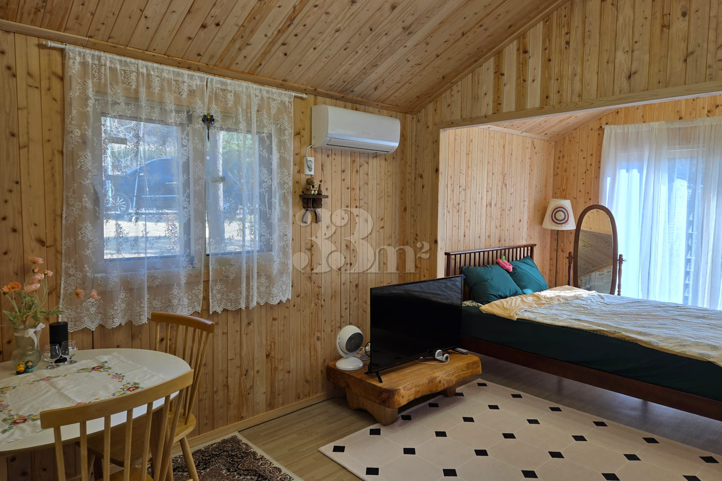 A room with a pretty garden in the forest. 17th image