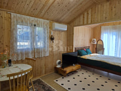 A room with a pretty garden in the forest. 17th image