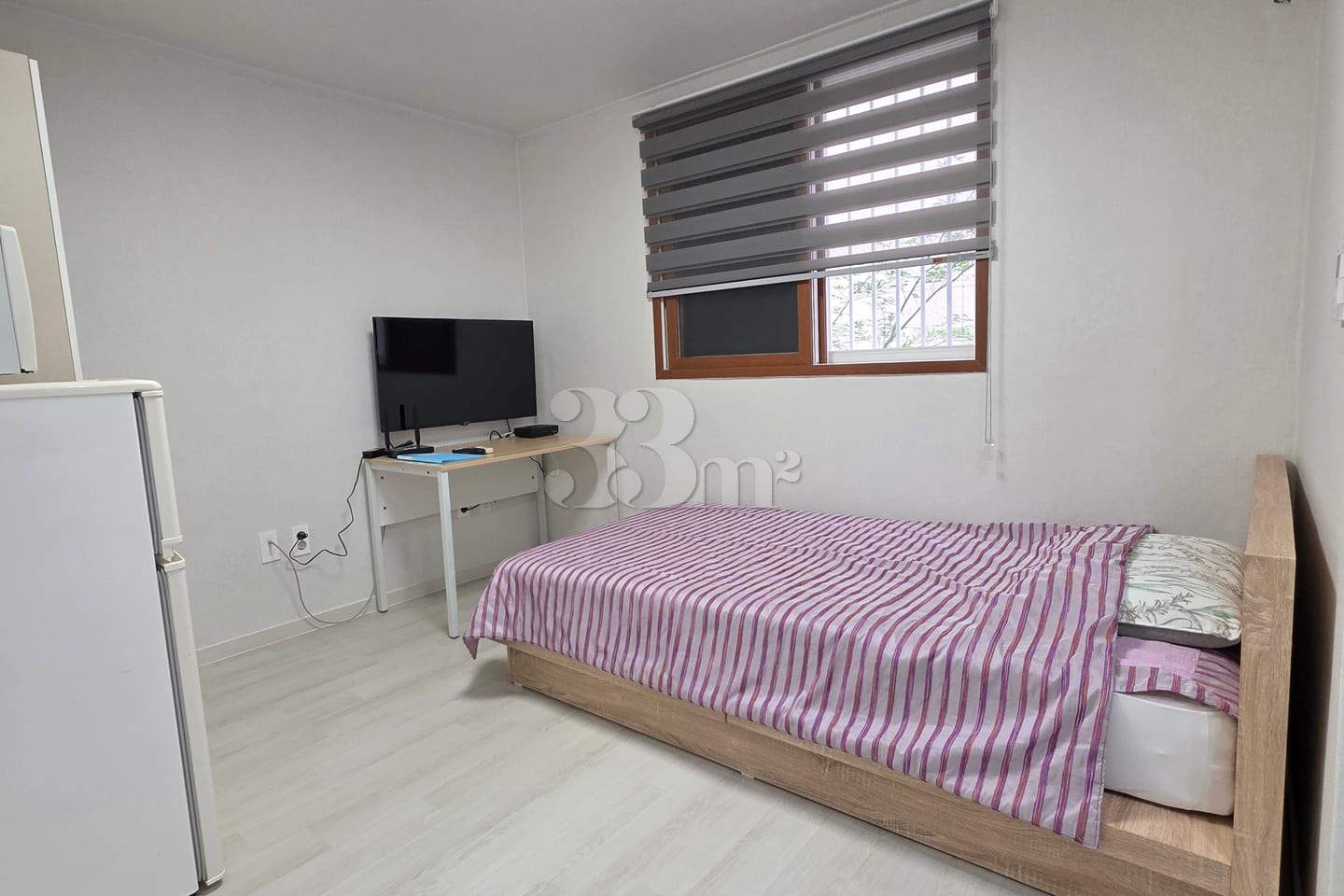 It is a neat studio apartment. 1th image
