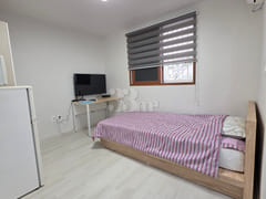 It is a neat studio apartment. 1th image