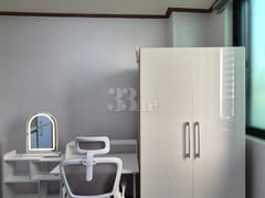 A studio apartment with a convenience store r 1th image