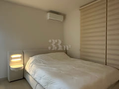 65-inch TV with separate bedroom and living r 5th image