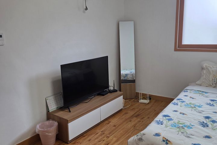 A quiet, comfortable, and spacious room 4th image