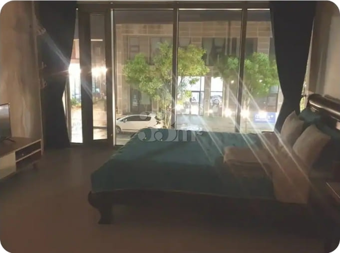 A room with a beautiful view and floor-to-cei 2th image