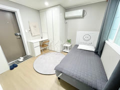 Newly remodeled white-toned room 5th image