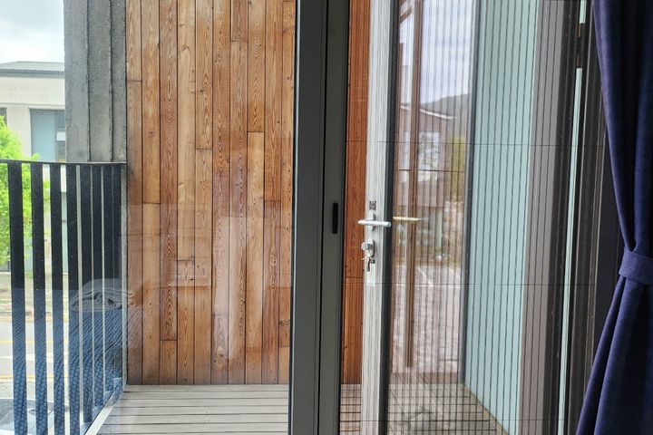 A glass-walled room with a terrace 17th image