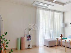 65-inch TV with separate bedroom and living r 1th image