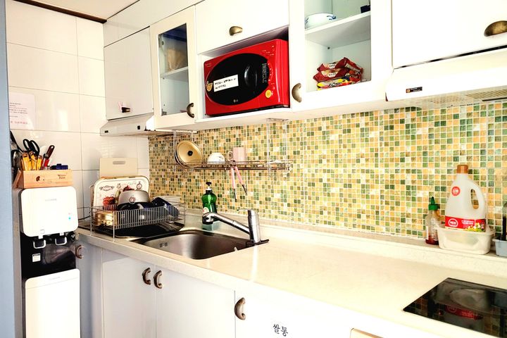 Unit 310: Studio-style room with an exterior  7th image