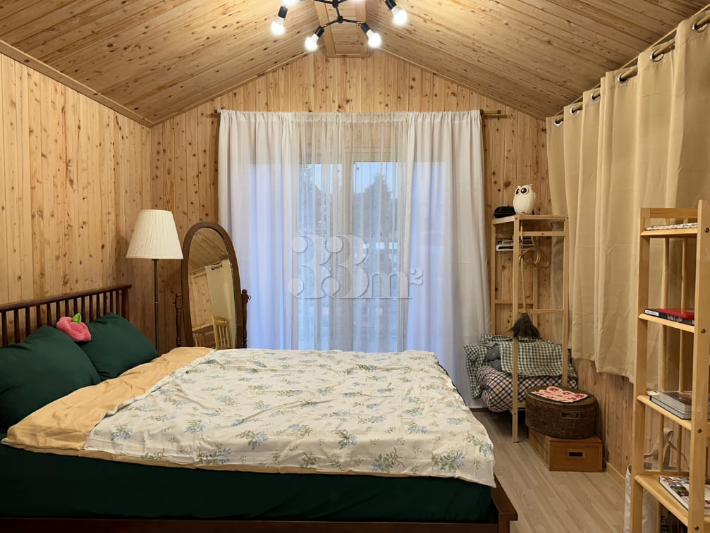 A room with a pretty garden in the forest. 12th image