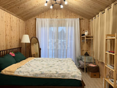 A room with a pretty garden in the forest. 12th image