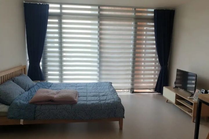 A glass-walled room with a terrace 8th image