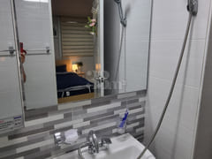 It is a neat, newly built room. 16th image