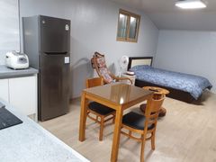 It's a clean two-story studio apartment. 1th image