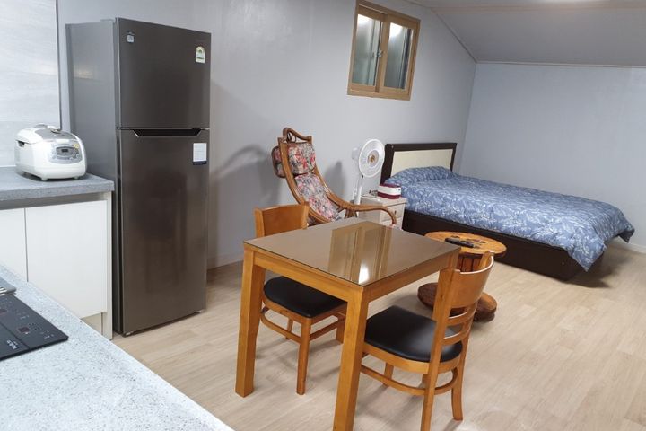 It's a clean two-story studio apartment. 1th image