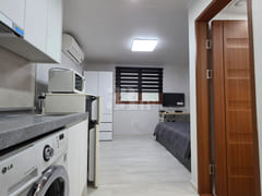 It is a neat studio apartment. 6th image