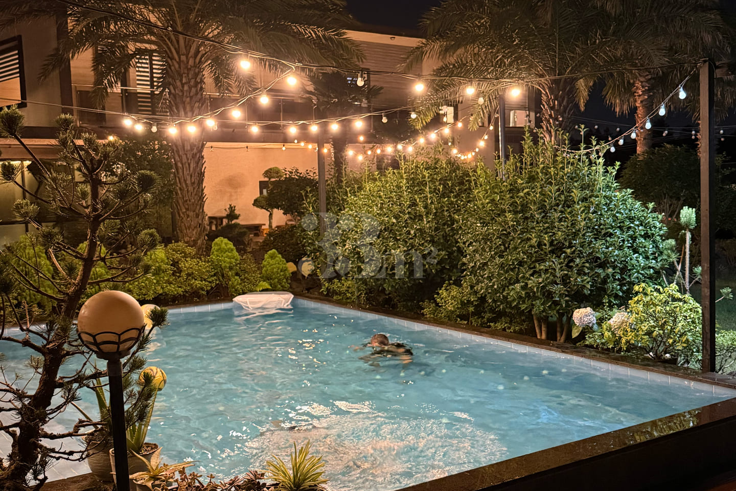 A house with a swimming pool and a yard 9th image