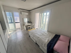 Fully furnished white-themed room in Junghwas 1th image
