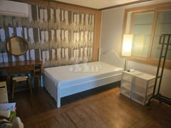 It is a studio apartment with a kitchen. 0th image