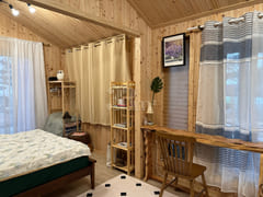A room with a pretty garden in the forest. 6th image