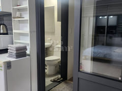 A room with a beautiful view and floor-to-cei 3th image