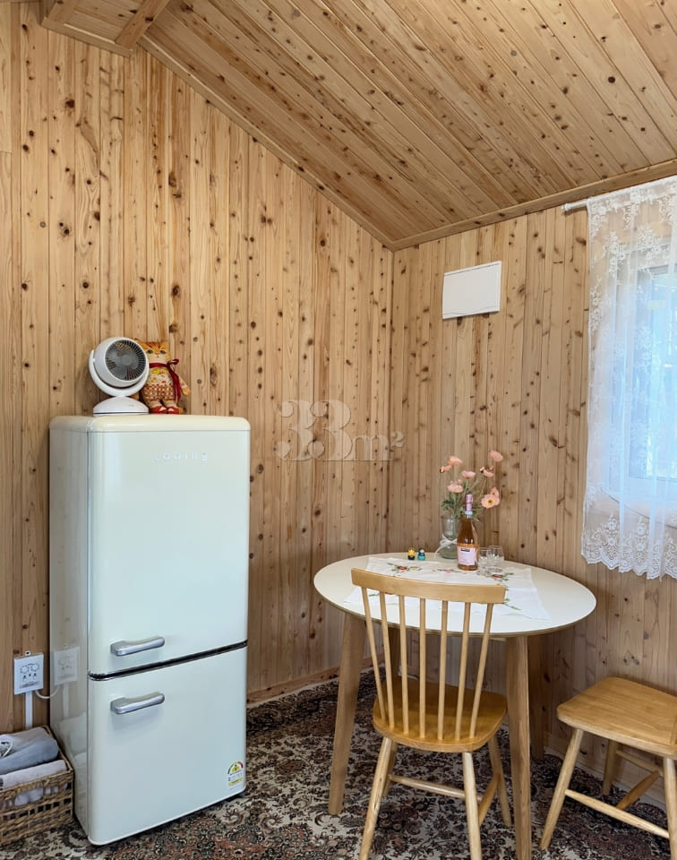 A room with a pretty garden in the forest. 11th image
