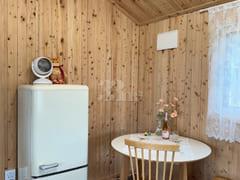 A room with a pretty garden in the forest. 11th image