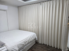 3rd-floor unit facing a park with a forest vi 7th image