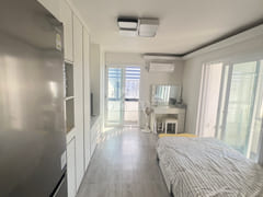 Fully furnished white-themed room in Junghwas 0th image