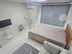 Spacious, fully-furnished studio apartment in 1th image