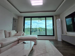 3rd-floor unit facing a park with a forest vi 17th image