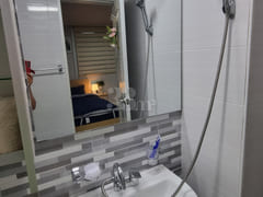 It is a neat, newly built room. 15th image