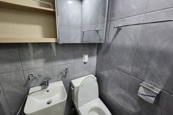 Clean white and gray studio apartment 6th image