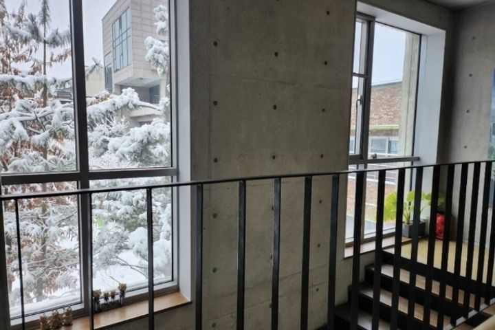 A glass-walled room with a terrace 10th image