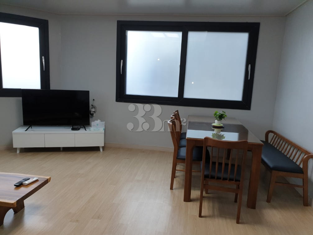 A house with a view of the sea and a lighthou 3th image
