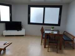 A house with a view of the sea and a lighthou 3th image