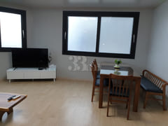 A house with a view of the sea and a lighthou 3th image