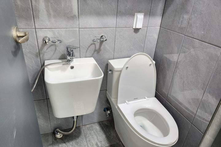 Clean white and gray studio apartment 1th image