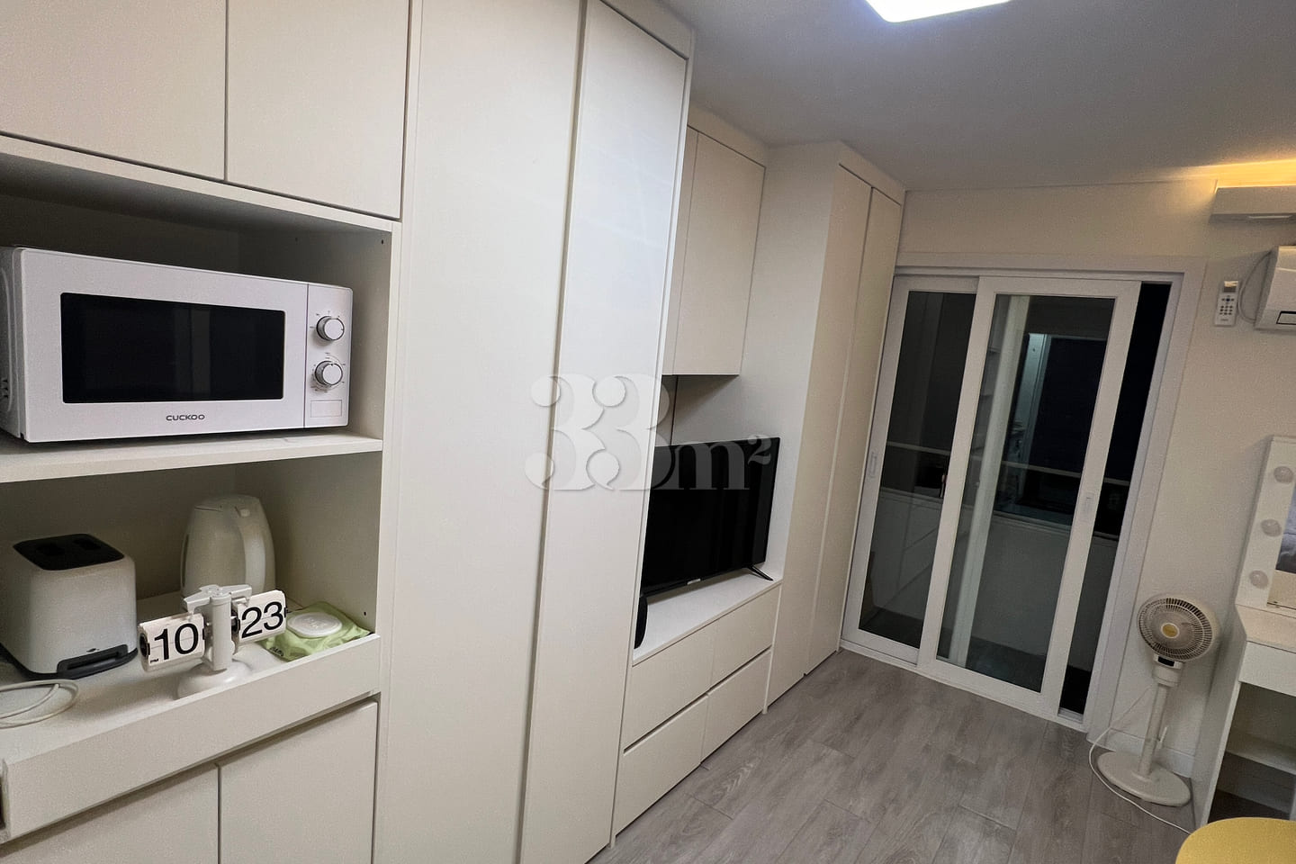 Fully furnished white-themed room in Junghwas 10th image