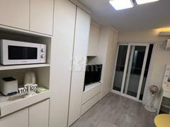 Fully furnished white-themed room in Junghwas 10th image
