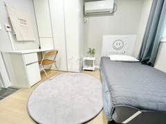 Newly remodeled white-toned room 1th image