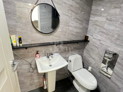 Fully furnished white-themed room in Junghwas 12th image