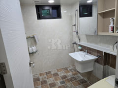 3rd-floor unit facing a park with a forest vi 6th image