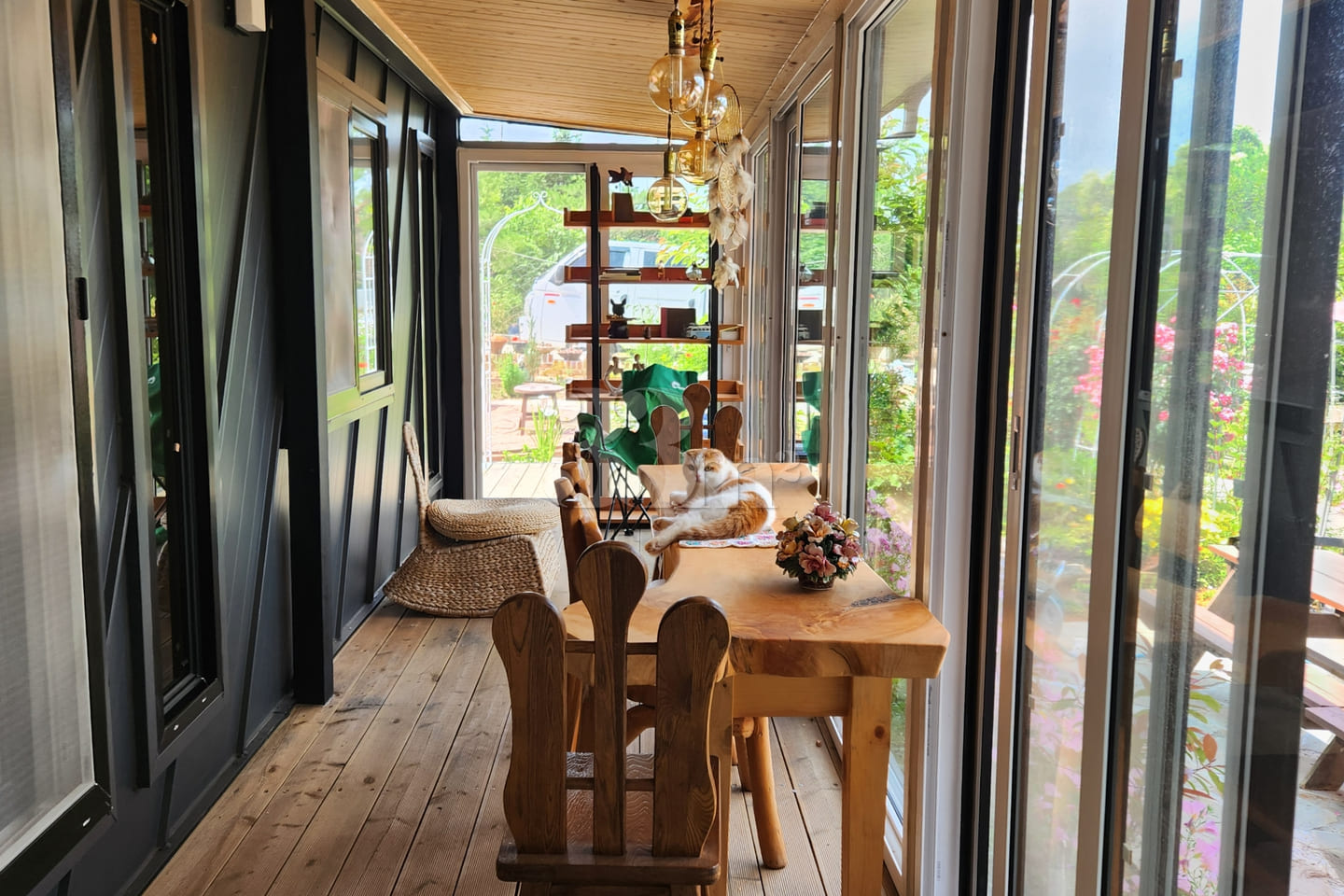 A room with a pretty garden in the forest. 2th image